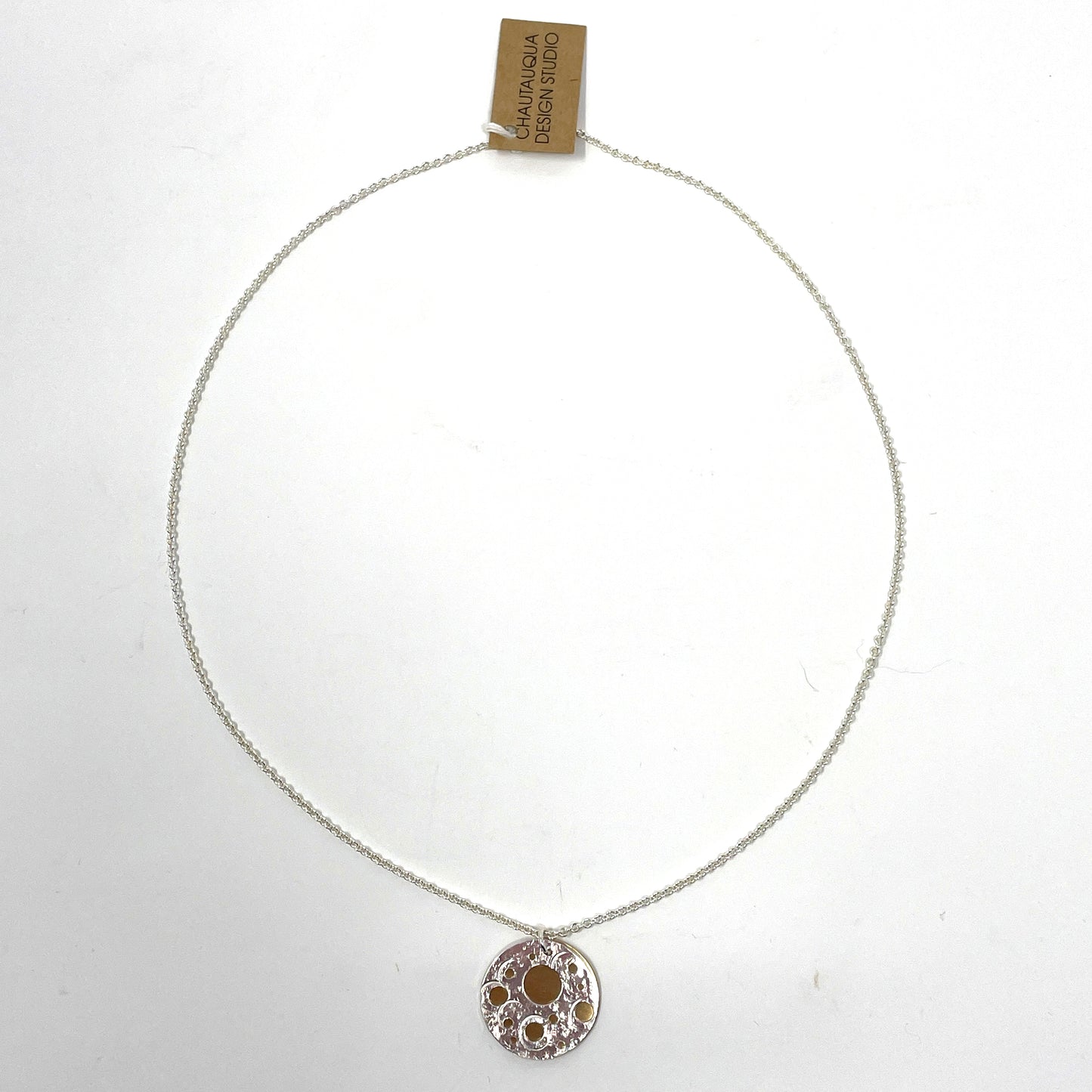 Silver and Brass Pierced Disc Necklace