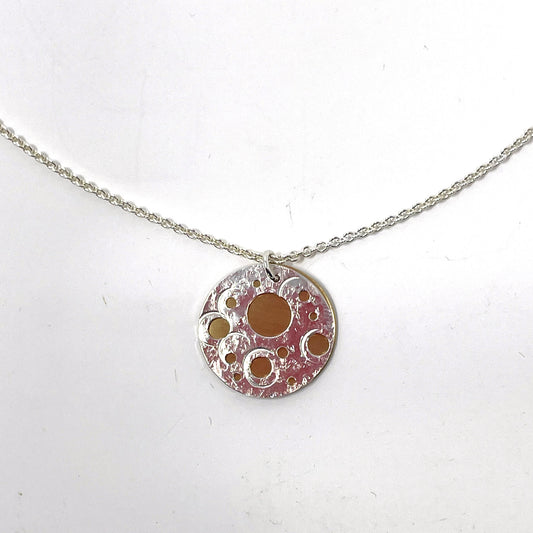 Silver and Brass Pierced Disc Necklace